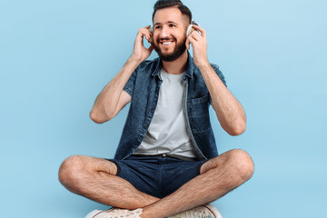 A man listens to music with headphones