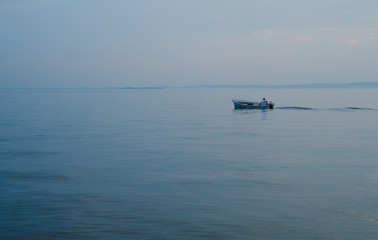 Small fisherman boat on a lake in Italy