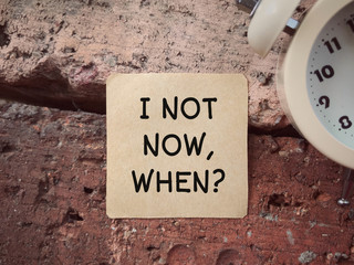 Motivational and inspirational wording. IF NOT NOW WHEN written on a paper.