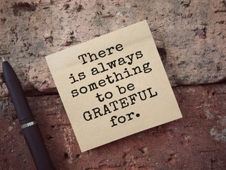 Motivational and inspirational wording. There Is Always Something To Be Grateful For written on an...