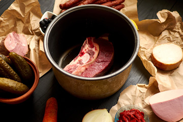 Ingredients, cooking meat soup from meat and various sausage hodgepodge.