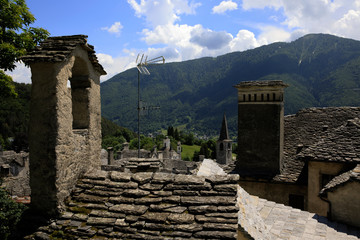 Fototapeta na wymiar Craveggia (VCO), Italy - June 2, 2018: Chimneys at Craveggia village, Vigezzo Valley, VCO, Piedmon, Italy