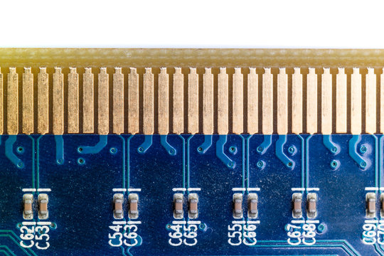 Macro close up view of a blue circuit board and row of  golden connector pins