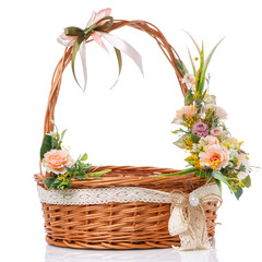 Fototapeta na wymiar Basket with high handle. Decor of quail eggs and various flowers. Isolated