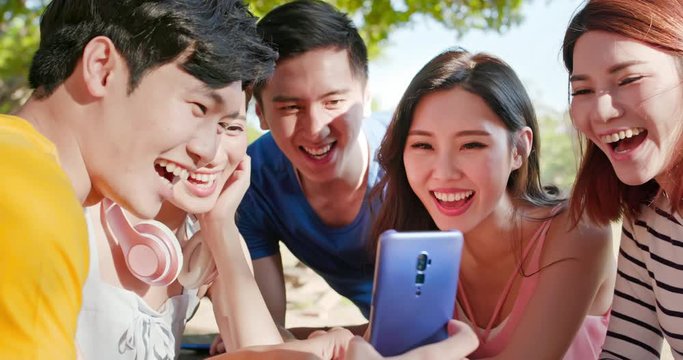 young asian teen use smartphone