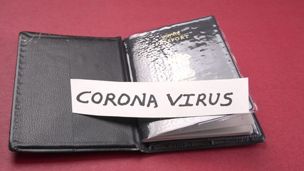 Coronavirus and travel concept. Note COVID-19 /coronavirus, passport with sanitizer and handwash protection from corona virus.Travel restrictions and quarantine of tourists infected with Corona virus