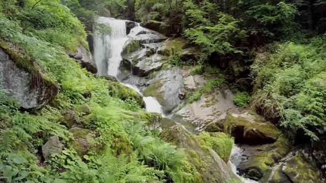 POV Walking toward beautiful waterfall in forest wilderness.Triberg Gutach river waterfall. Power of nature
