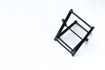 black folding phone holder, on a white  background