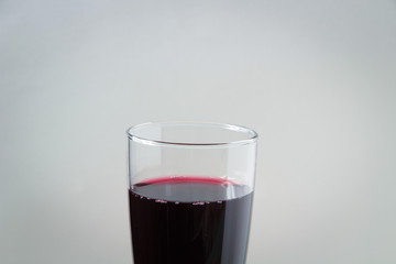 glass of red wine on a white background