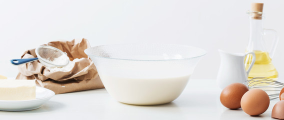 dough in glass plate and products for its preparation on  white