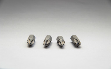 Set of bits for screwdriver. Nozzles and adapters for screwdrivers. on white background