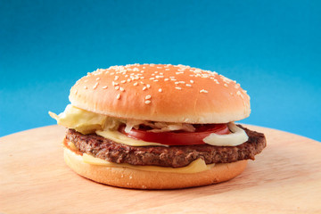 burger, on a blue background, hamburger, and a wooden board, fast food