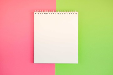 Blank notepad on bright background.