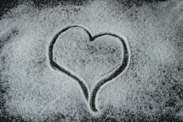 heart, drawn by sugar on a black background, valentines day