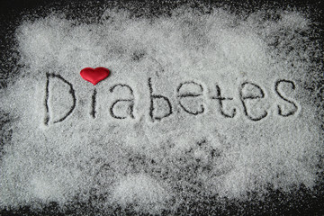 the word diabetes, sugar written on a black background with a red heart