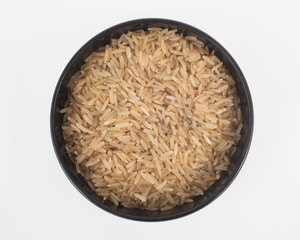 A bowl of uncooked brown rice