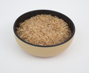 A bowl of uncooked brown rice