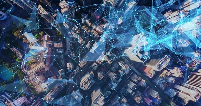 Aerial. Camera moving around buildings. Wireless communication network concept. IoT Internet of Things. ICTInformation Communication Technology. - Powered by Adobe