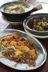 Delicious herbal meat soup Bak kut teh,  Dry bak kut teh, the type prepared with dried chilies and cuttlefish, and fried bak kut teh with pickled and seafood.  