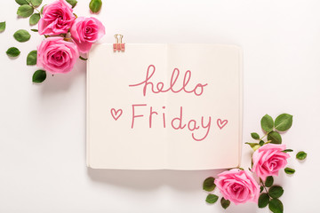 Hello Friday message with roses and leaves top view flat lay © Tierney