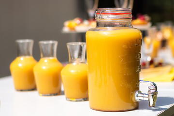 Pitcher and jar of orange juice