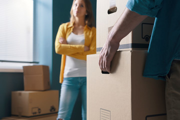 Young couple moving in a new apartment