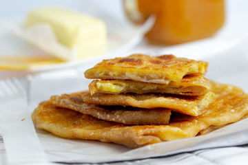 Pan fried whole wheat paratha, stuffed with sliced banana and cheese, crispy on the outside and soft on the inside