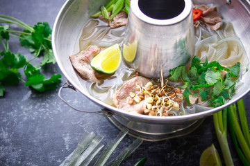 Vietnamese pho bo soup, Asian cuisine, Photo on a dark background
