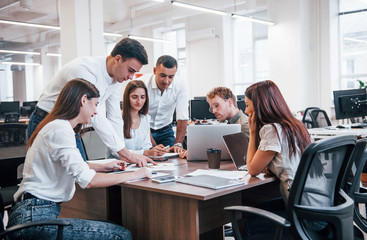 Young business people working together in the modern office