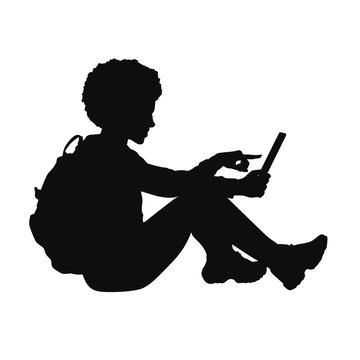 Silhouette of schoolgirl uses gadget
