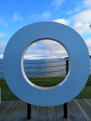 Letter O near the sea