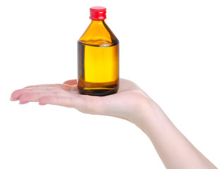 Hand holding medicine bottle of brown glass alcohol on white background isolation