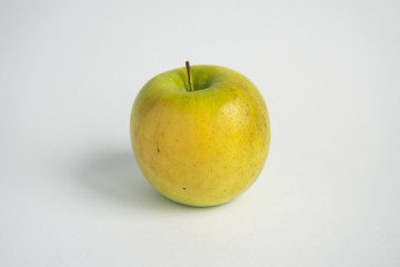 green-yellow apple on a white background. Fruit isolate