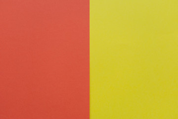 Bright yellow and red cardboard background, vertical division