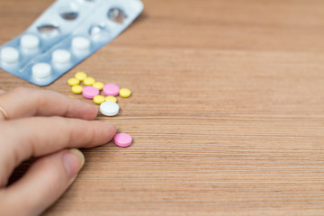  coins, pill on the table 