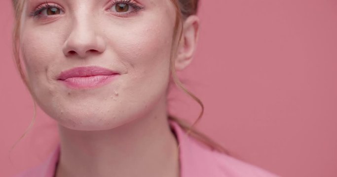 Wonderfull Girl is showing her Natural Beautifull Face on Studio. Real beauty Girl is having amazing long Lashes, natural Eyebrows and Lips. Having nice pink Style, pink natural Makeup. Beauty. Face.