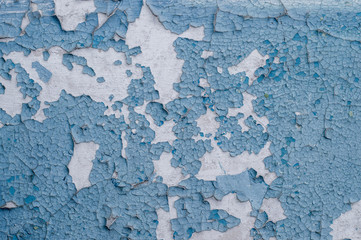 Old painted wall with cracked paint