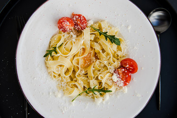 Classic italian spaghetti pasta with cherry tomatoes and cheese parmesan