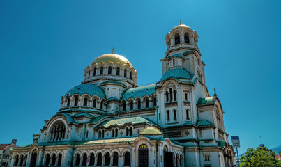 Fototapeta premium Side view of the Orthodox Alexander Nevsky Cathedral in Sofia, Bulgaria with beautiful blue skies