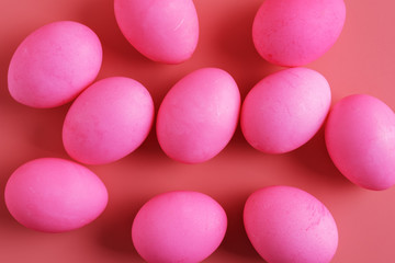 scattered Easter Eggs On Pink Background, flat lay, easter festive background