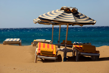 Prasonissi, Rhodes / Greece - June 23, 2014: Sun chairs at Prasonisi beach, Rhodes, Dodecanese Islands, Greece.