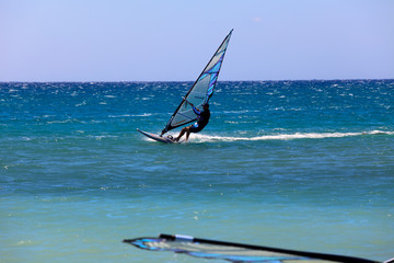 Naklejka premium Prasonissi, Rhodes / Greece - June 23, 2014: Surfer at Cape of Akra Prasonisi, Rhodes, Dodecanese Islands, Greece.