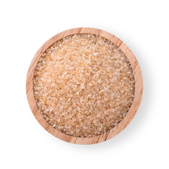 Sugar in a wooden cup isolated on a white background. Top view