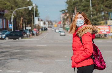 Obraz premium Virus concept. Girl in mask at city, risk for health, pneumonia, quarantine and epidemic