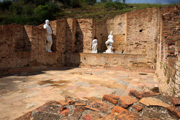 Roselle (GR), Italy - June 19, 2017: Etruscan ruins and statue in archaeological site in Roselle,...