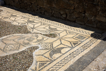 Roselle (GR), Italy - June 19, 2017: Etruscan ruins and mosaic in archaeological site in Roselle, Grosseto, Tuscany, Italy, Europe