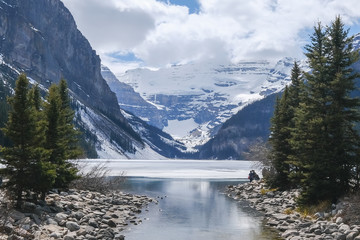 Mount fairview, partly frozen lake, with reflection in water. Lake Louise Banff National Park, Alberta Canada