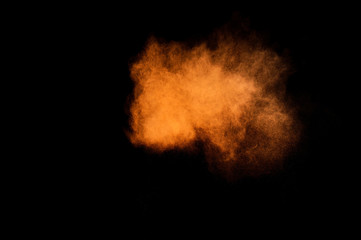 Fototapeta na wymiar Orange powder explosion.