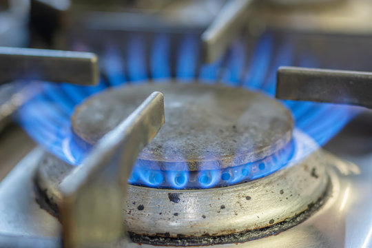 Gas flame burning on kitchen hob