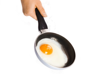 a pan in hands on a white background